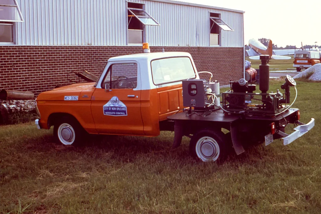 Gulf Coast mosquito-control rig — the scale of equipment working West Mobile neighborhoods