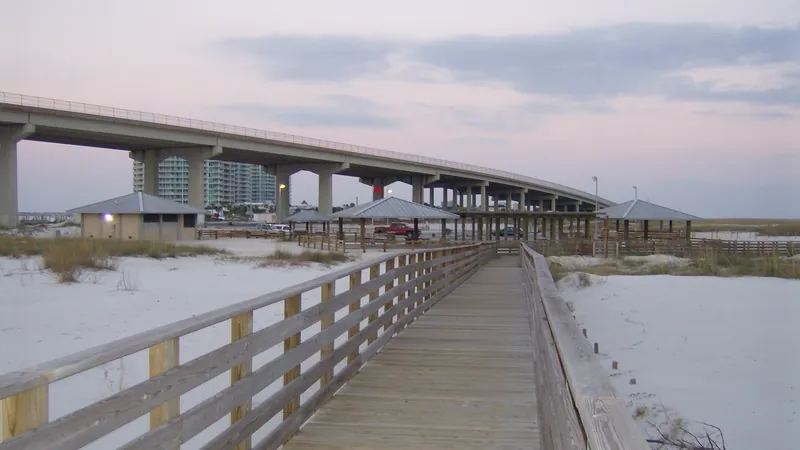 Perdido Pass shoreline at Gulf State Park near Gulf Shores, AL, in the vacation-rental corridor where bed bugs arrive with luggage