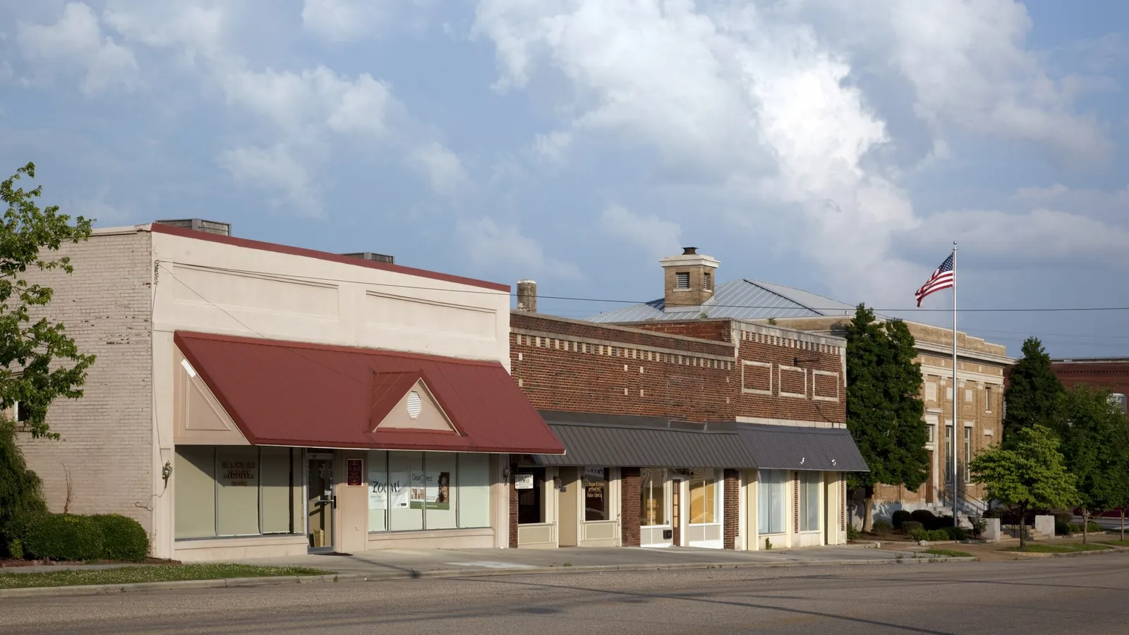 Historic downtown storefronts in Cullman, AL, where brick commercial buildings and North Alabama winters shape rodent and roach pressure