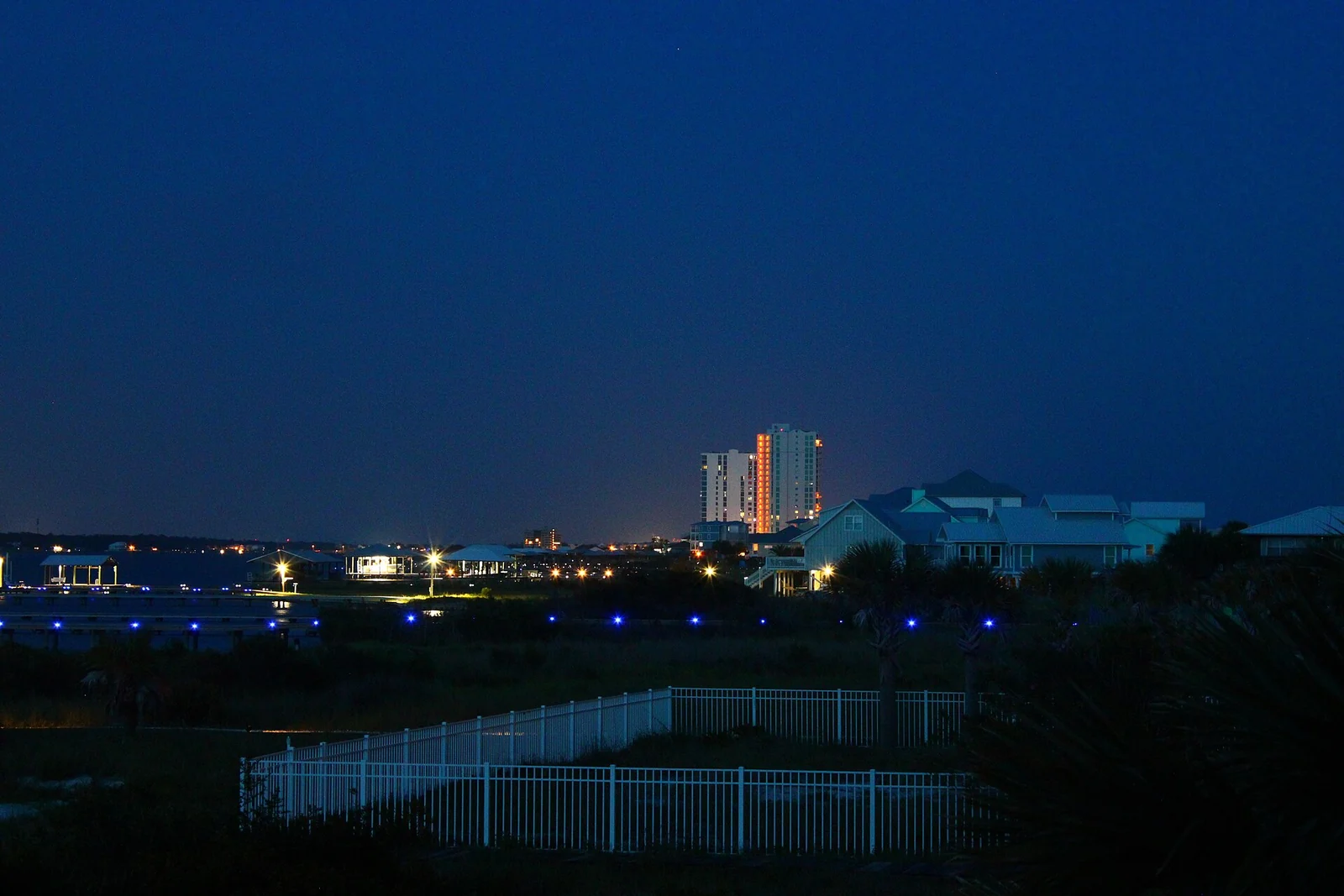 Evening skyline of the beachfront community at Gulf Shores, Alabama seen across the dunes