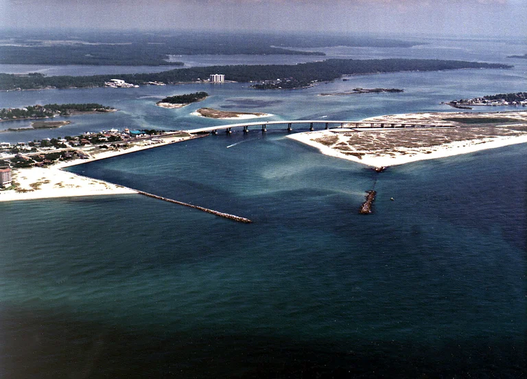 Perdido Pass on the Alabama coast near Lillian — the brackish waterline that sets pest pressure along Perdido Bay