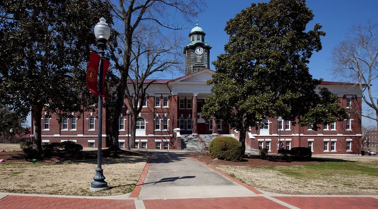 White Hall on the Tuskegee University campus in Macon County, Alabama — historic masonry and pier foundations set on Black Belt clay