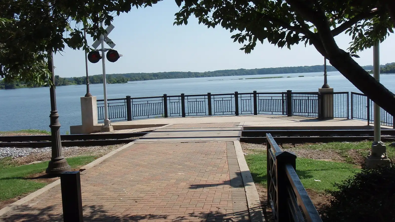 Wheeler Lake and the rail corridor at Decatur, AL, where riverfront grain handling and Old Decatur crawlspace cottages drive rodent pressure